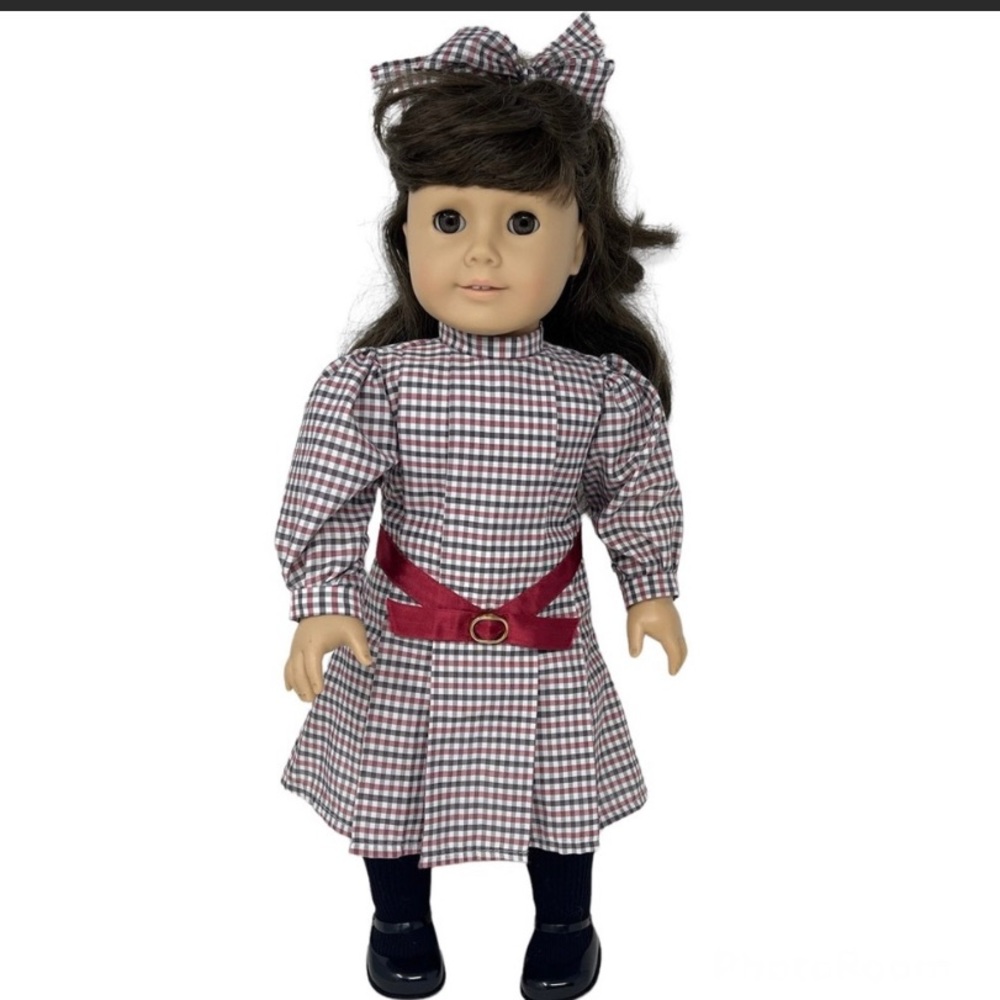 Retired American Girl doll, Samantha Parkington. With all shown outfits